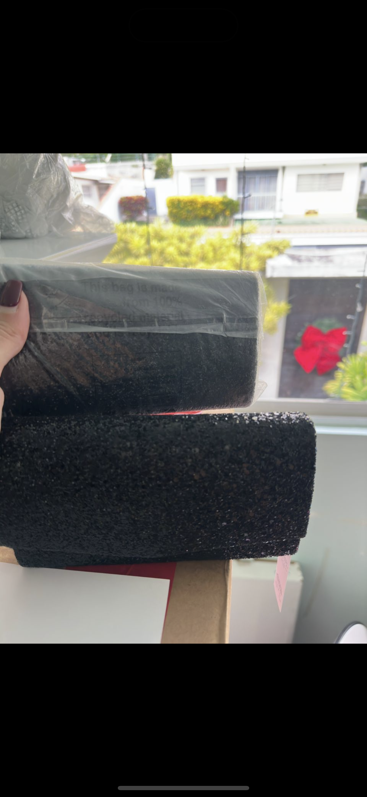 Clutch negra brillante